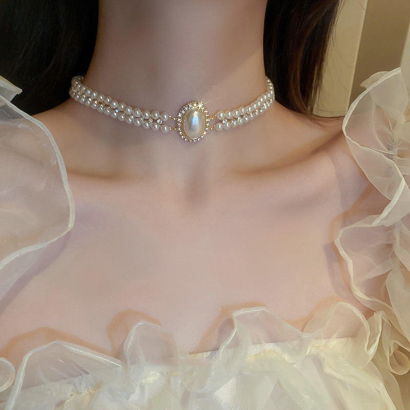 French minimalist luxury diamond-accented artificial pearl necklace, vintage-stylesophisticated piece